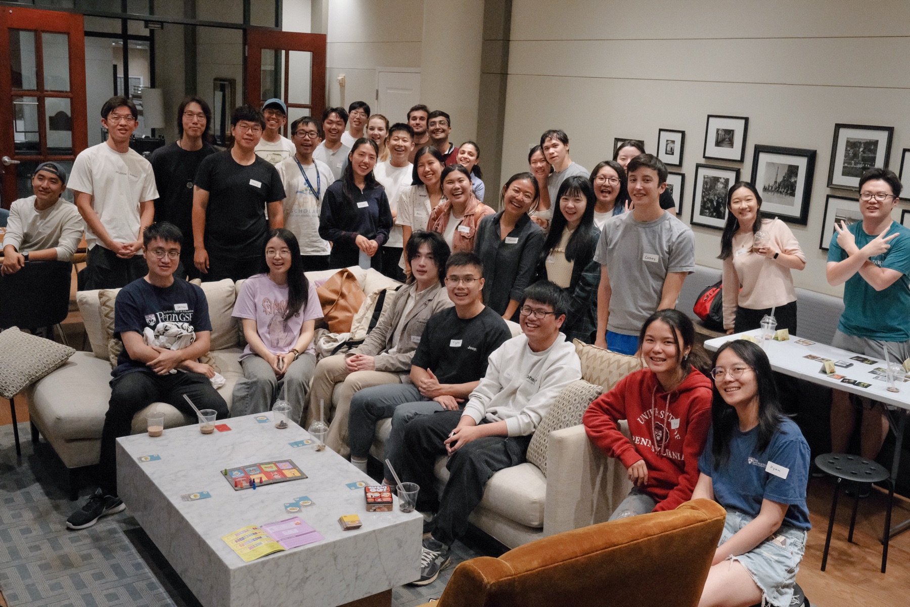 A large group of ISMP students and mentors at a board game night in Philadelphia